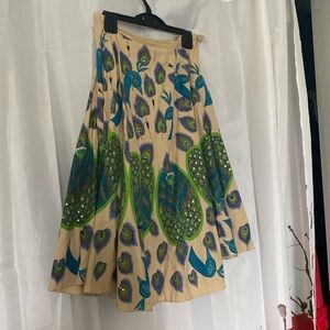 Heart Moon Star A-Line Skirt with Vibrant Peacock Design
